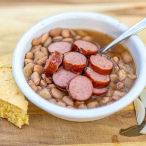 Slow Cooker Pinto Bean Soup with Cornbread and Raw Onion.