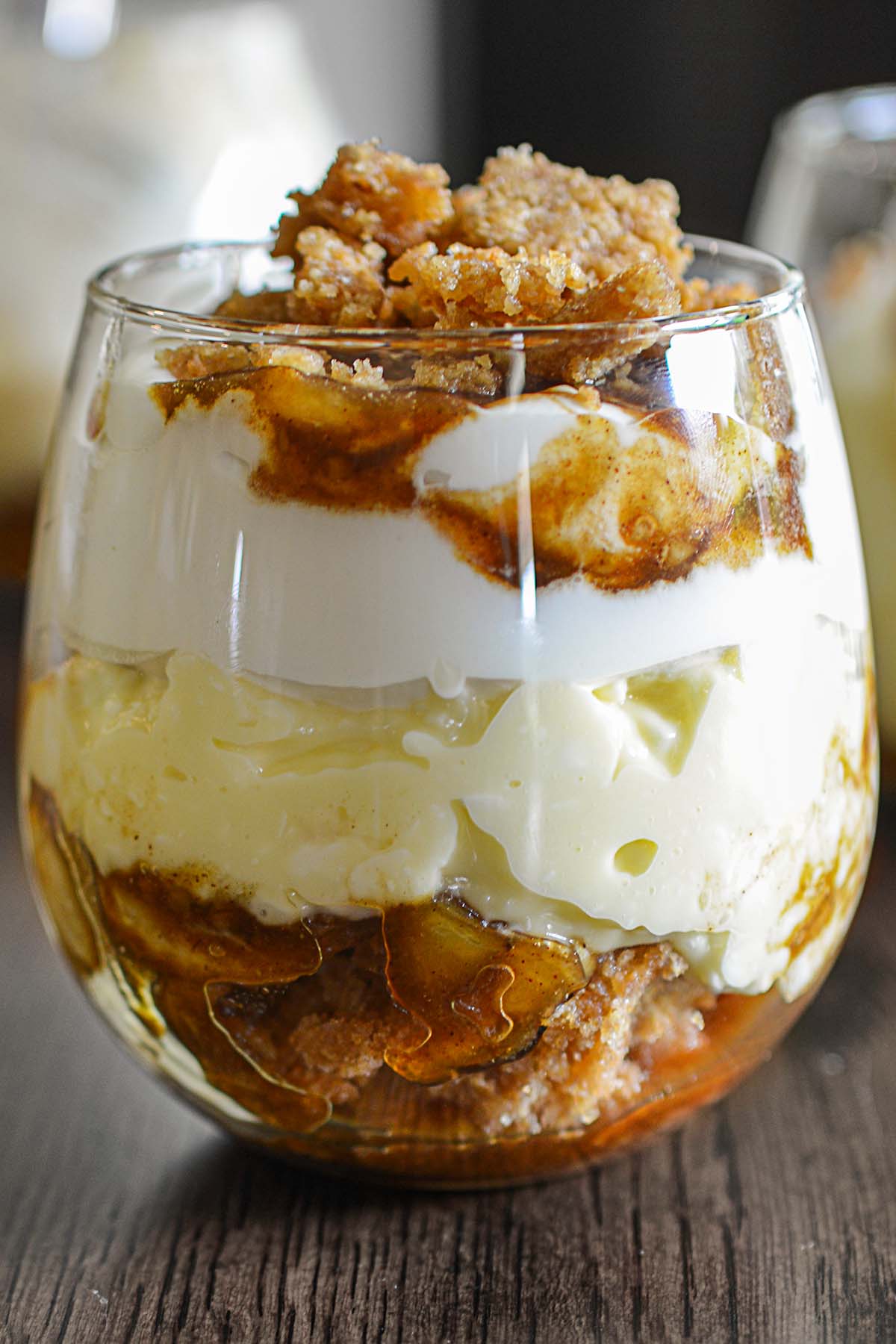 Bananas Foster Banana Pudding served elegantly in a wine glass.