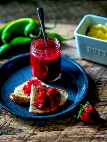 Strawberry Rhubarb Preserve with Hatch Green Chiles Jarred and served on toast.