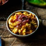 Hatch Green Chile Mac and Cheese Served and topped with Crispy Bacon.