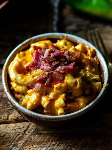 Hatch Green Chile Mac and Cheese Served and topped with Crispy Bacon.