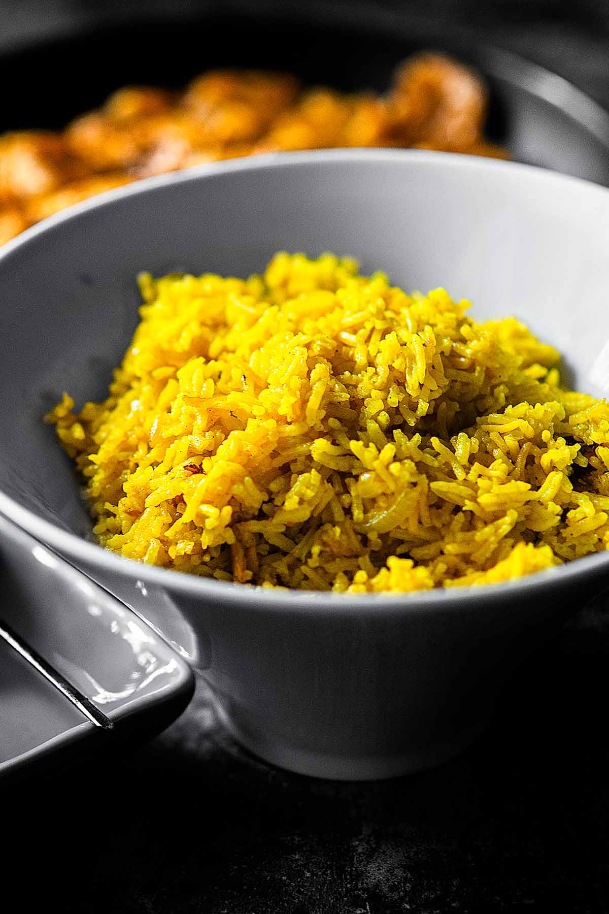 Turmeric Rice served in a white bowl.