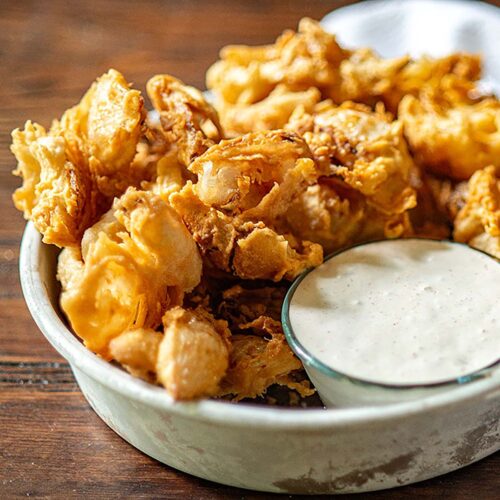 https://chickenfriedkitchen.com/wp-content/uploads/2021/07/Fried-Onions-Tastee-Copycat-Recipe-Feature-500x500.jpg