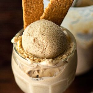 Bananas foster ice cream served with two graham crackers.