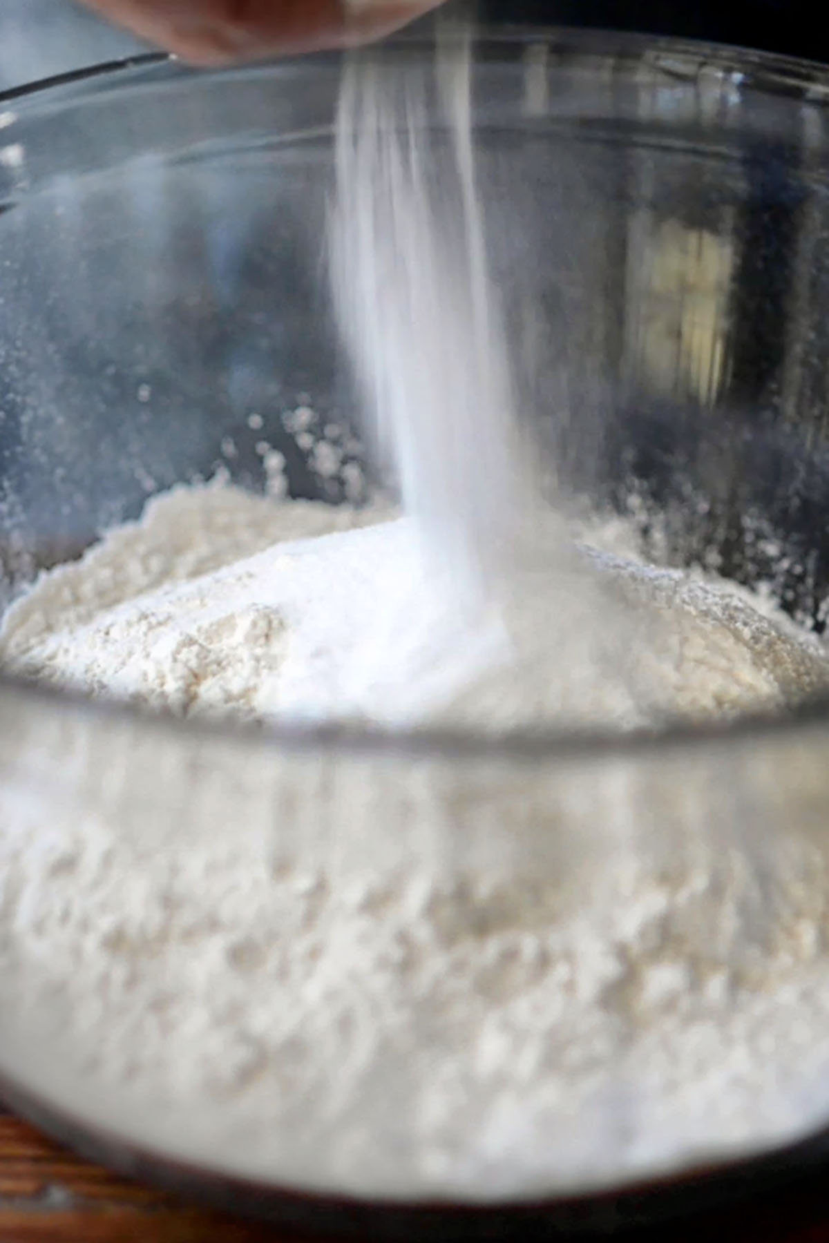 Flour in a glass mixing bowl.