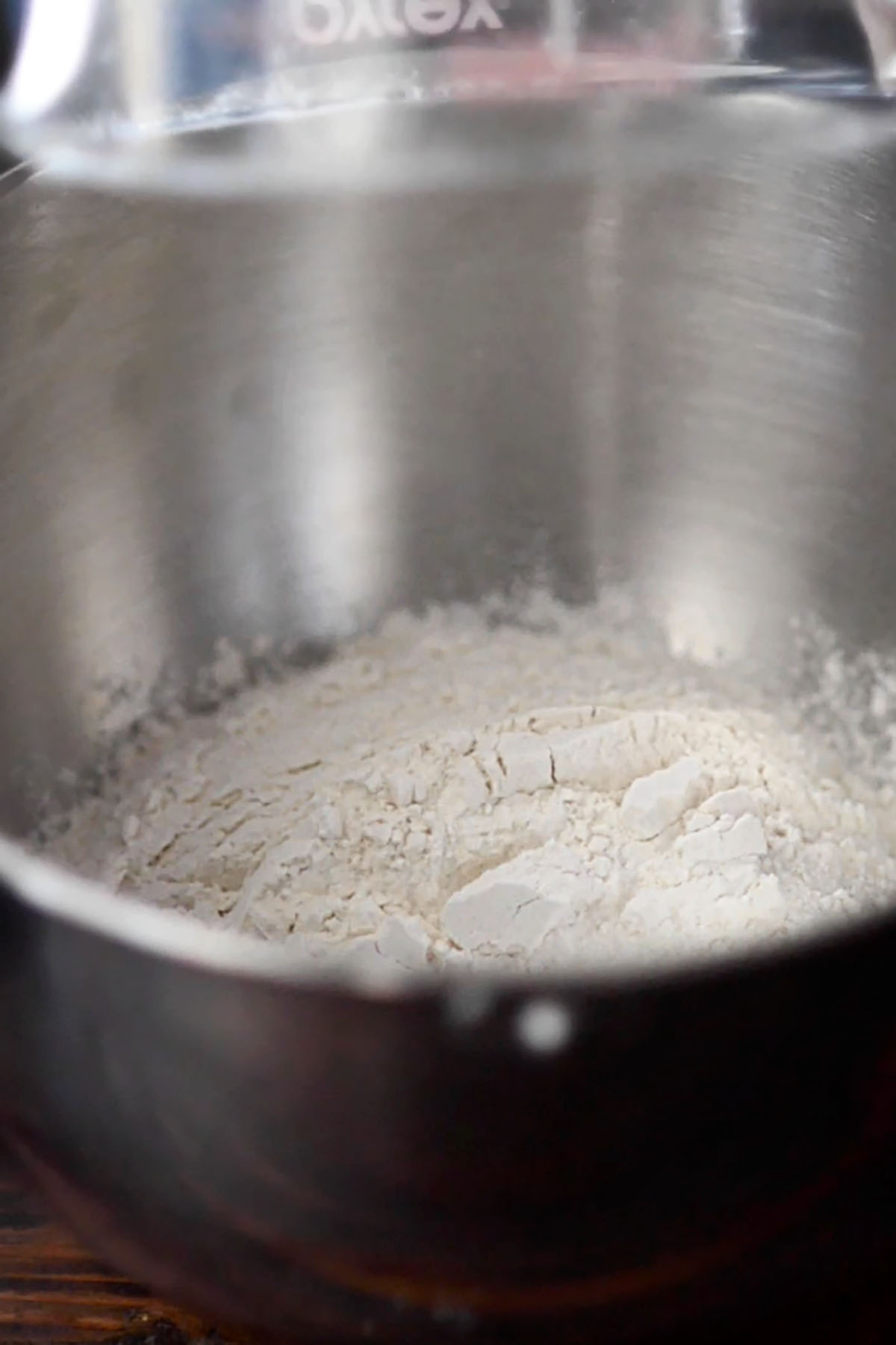 Flour in the pot of a stand mixer.