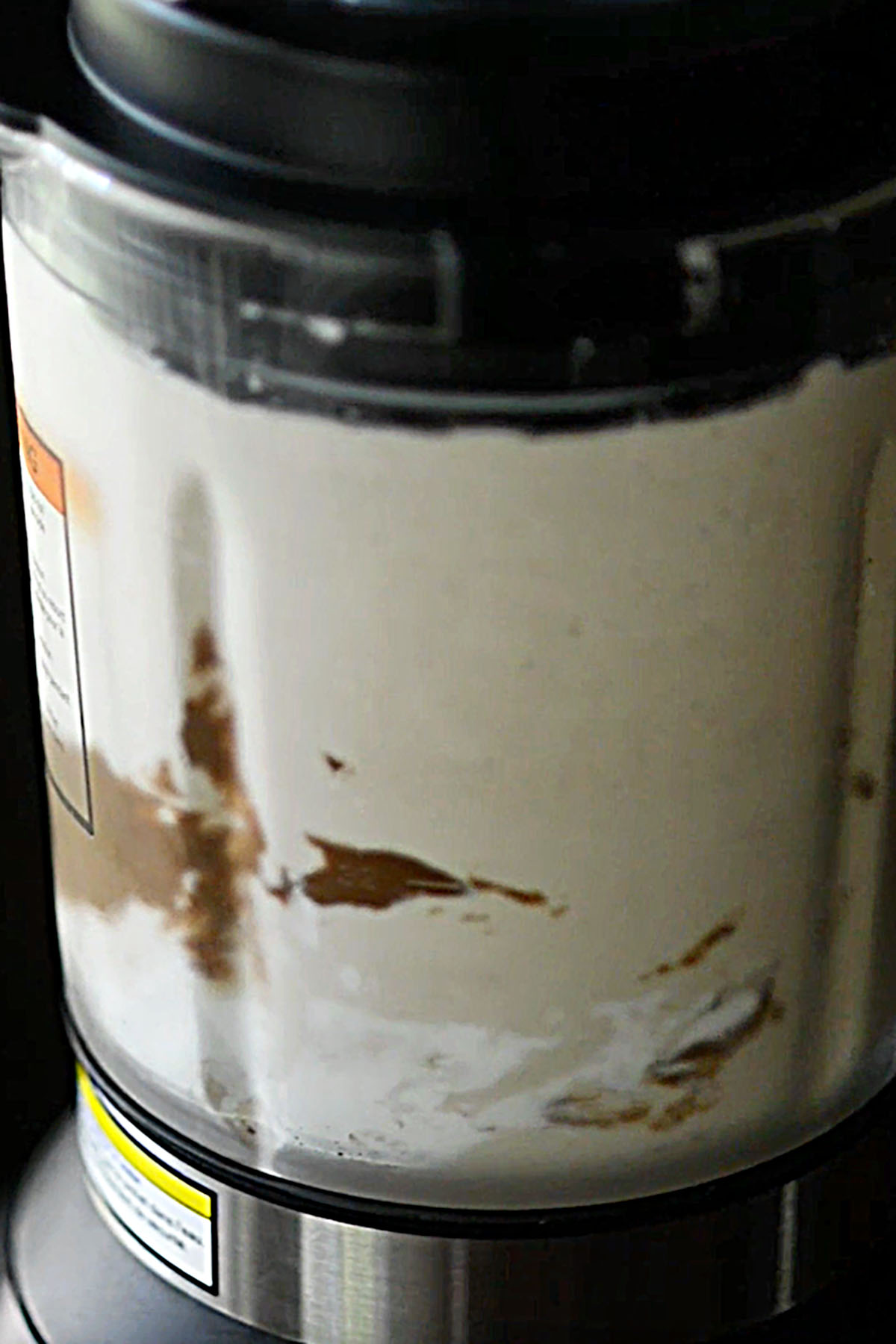 A blender blending milkshake ingredients.