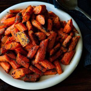 Roasted Carrots served on a large white plate.