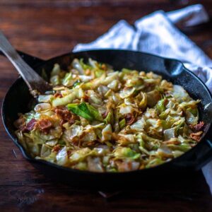 Fried Cabbage served in a cast iron skillet.