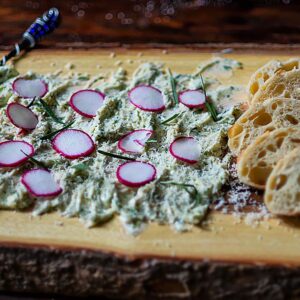 Butter Board Topped with Freshly sliced radish and served with Italian Bread.