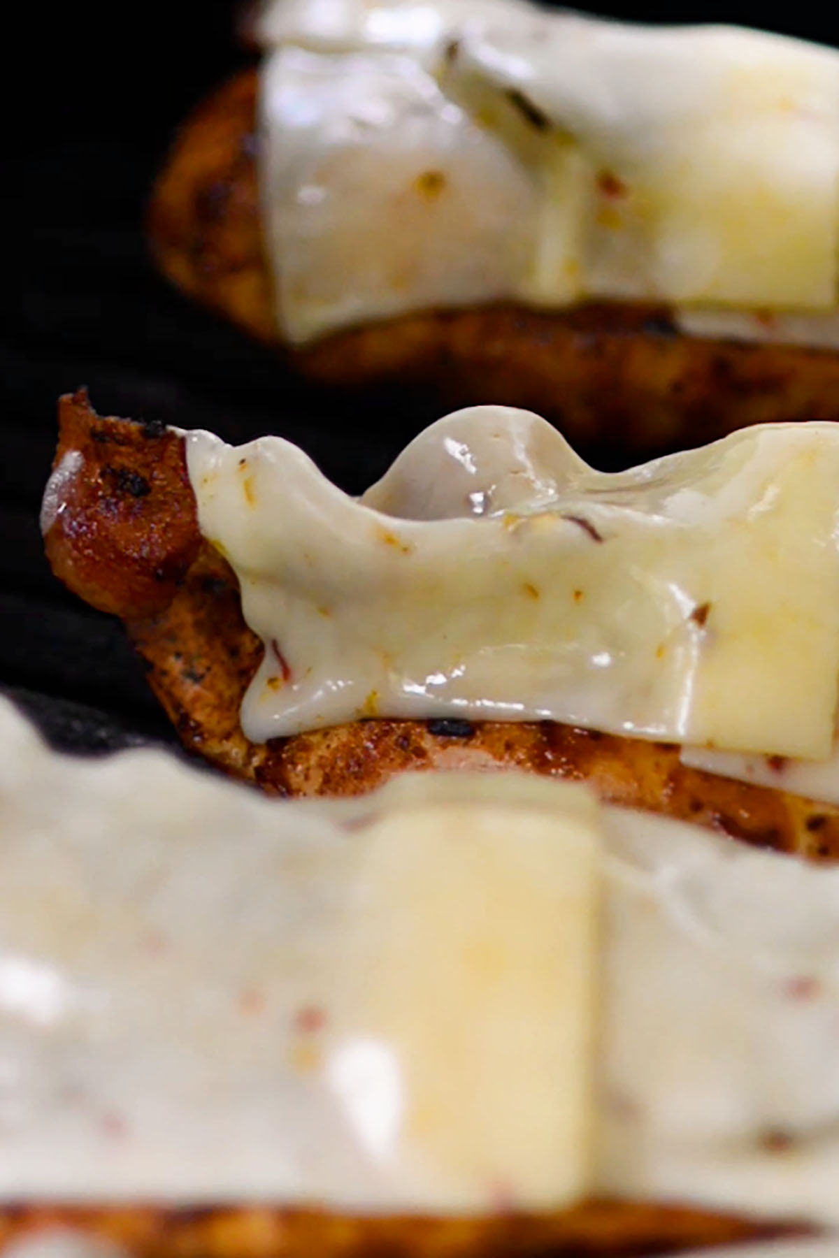 Grilled chicken breasts topped with crispy bacon strips and melted Monterey Jack Cheese.