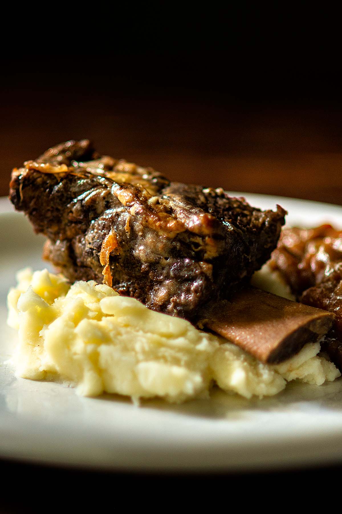 Beef Short Rib served over mashed potatoes.
