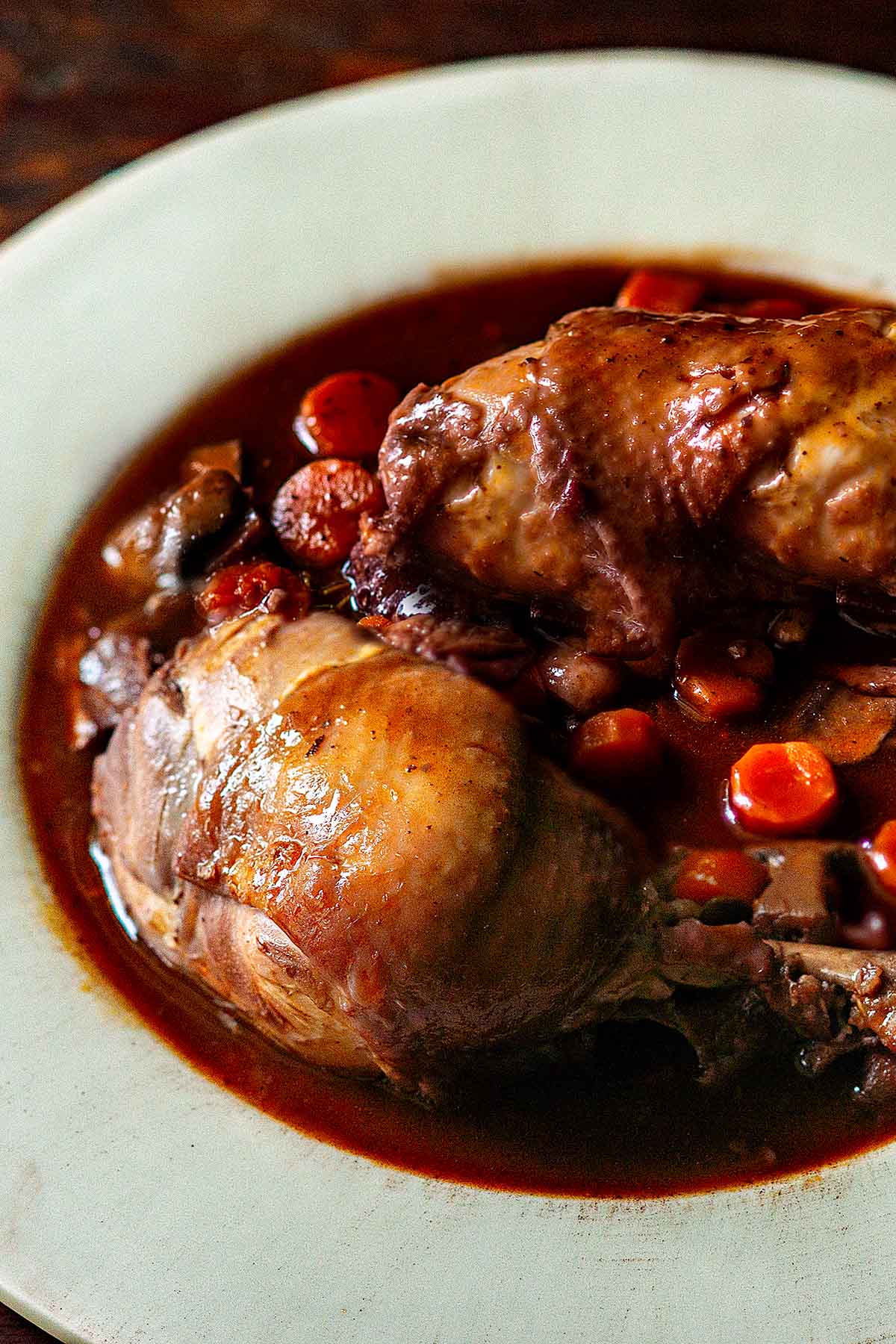 Coq au Vin served on a large plate.