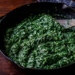 Creamed Spinach Served in a Cast Iron Skillet.