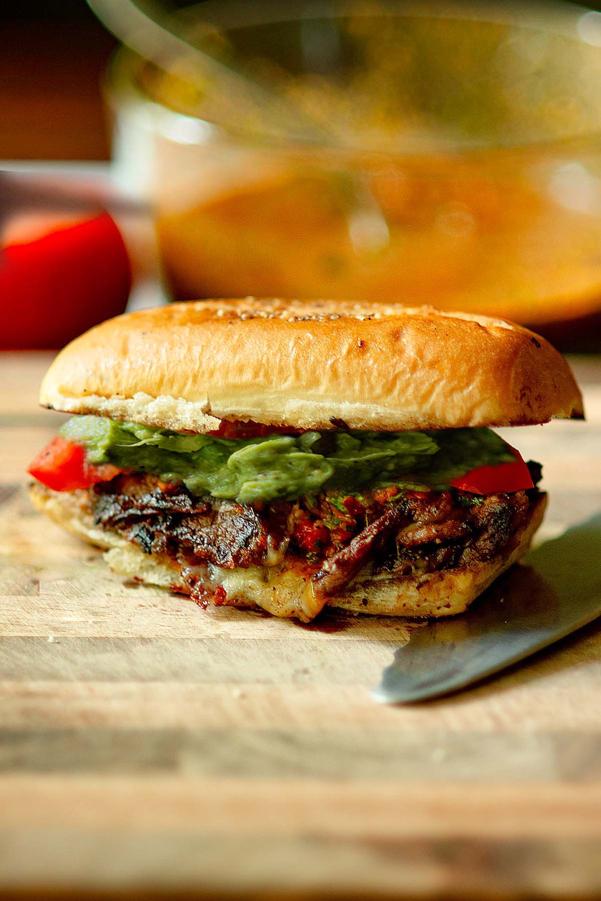 A Churrasco Italiano Steak Sandwich on a cutting board.