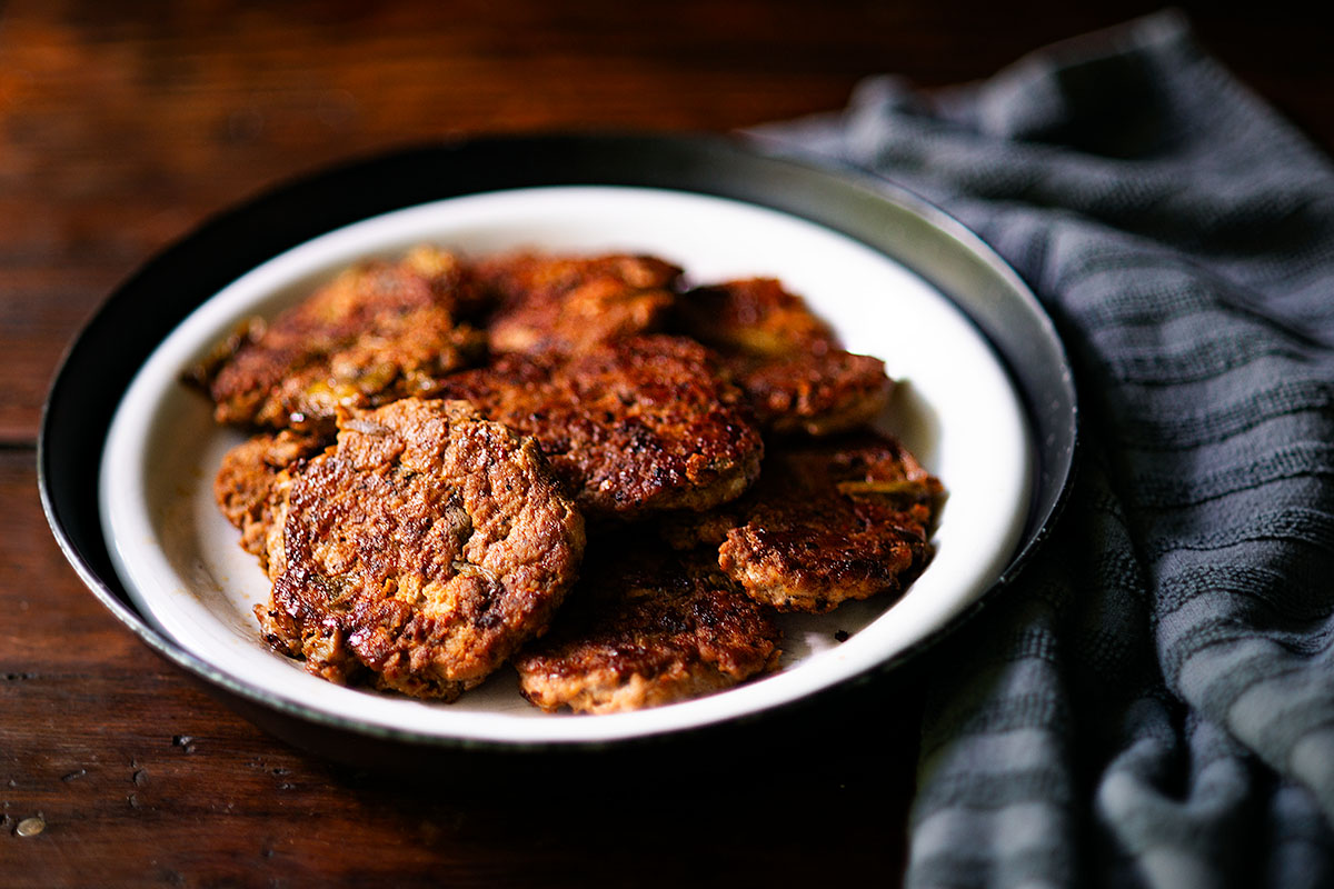 Chicken Breakfast Sausage Patties served family style on a plate.