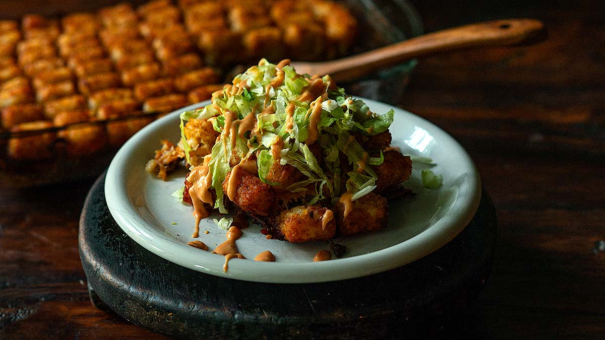 Bic Mac Casserole with Tater Tots served and topped with Big Mac Sauce and Shredded Lettuce.