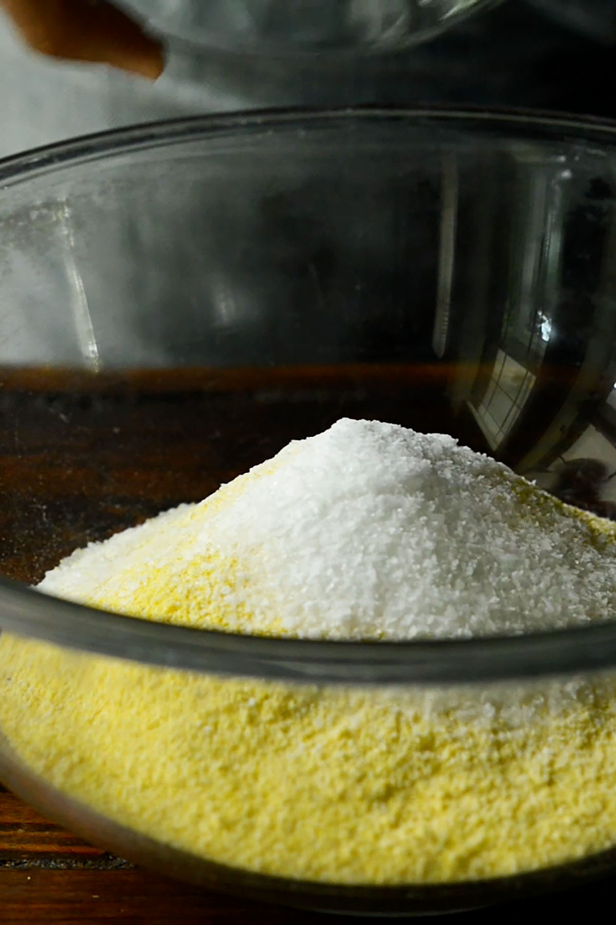 Hot water cornbread mix in a glass mixing bowl.