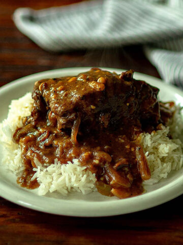 Southern smothered Oxtails and gravy served over rice.