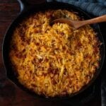 Hash-Brown Casserole baked and served in a cast Iron Skillet.