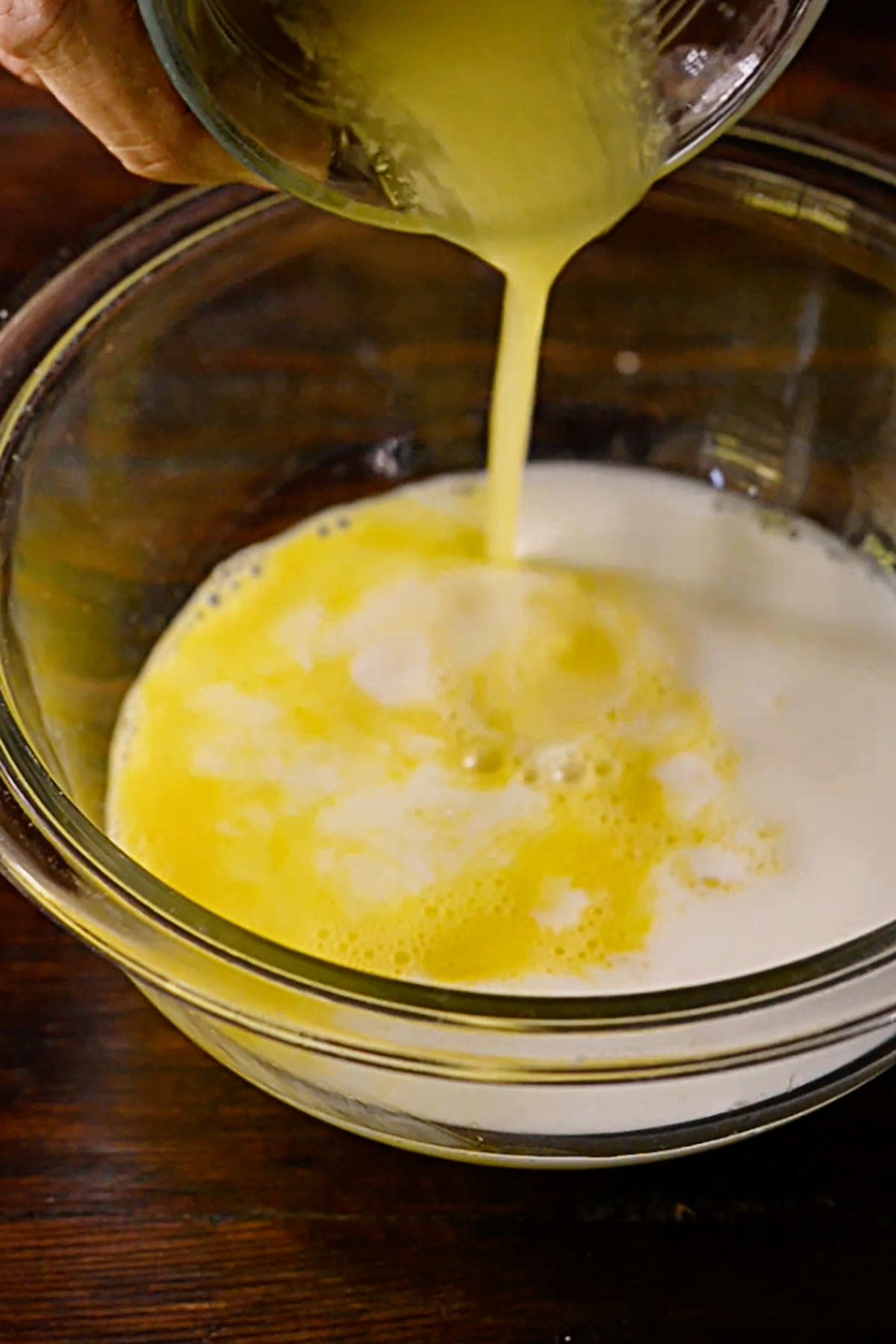 Egg, milk, and butter in a mixing bowl.