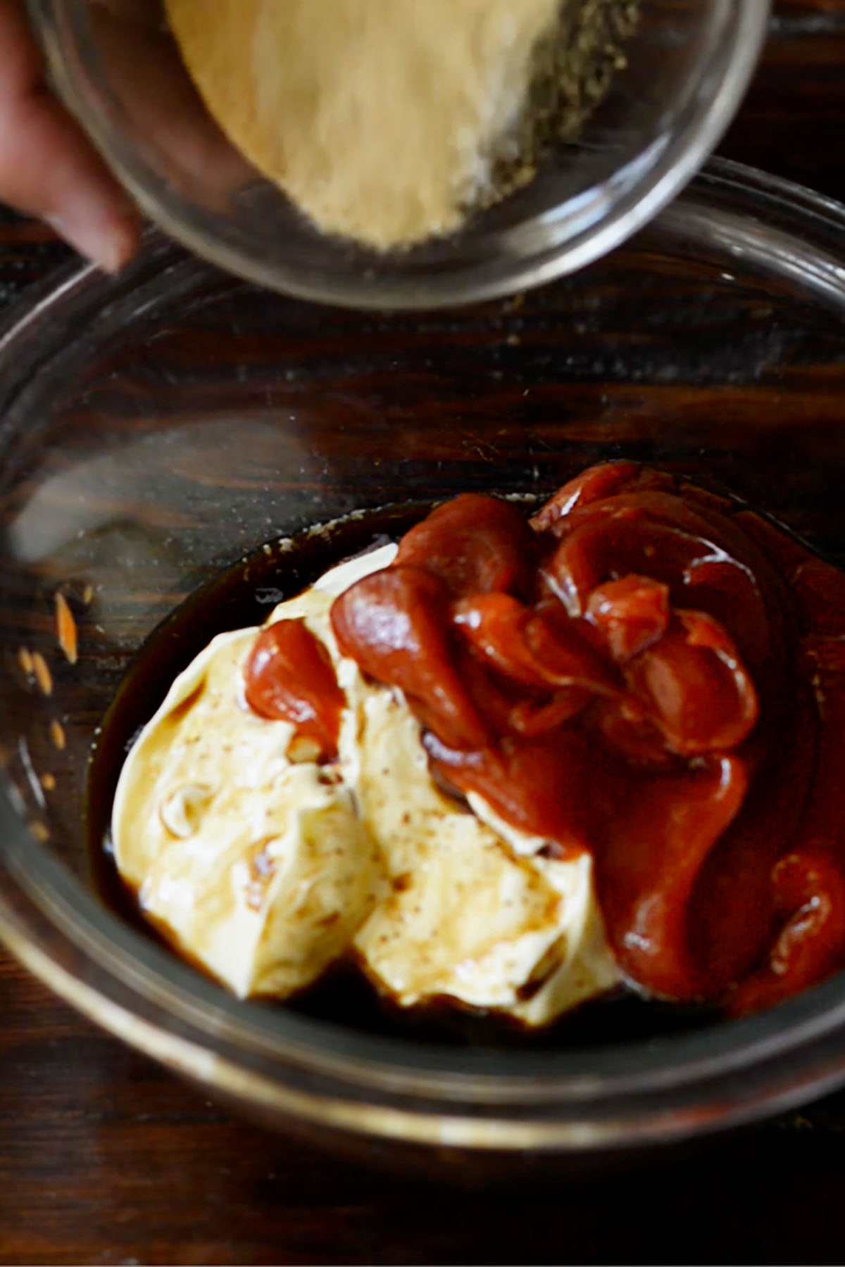 Ketchup, Mayonnaise, Worcestershire Sauce, and seasoning in a mixing bowl for copycat Cane's sauce.