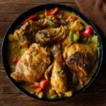 Filipino Chicken Curry Served family style in a deep dish featuring the chicken, curry sauce, and vegetables.