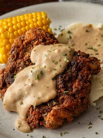 Chicken Fried Steak with Cream Gravy, Mashed Potatoes, and Corn.