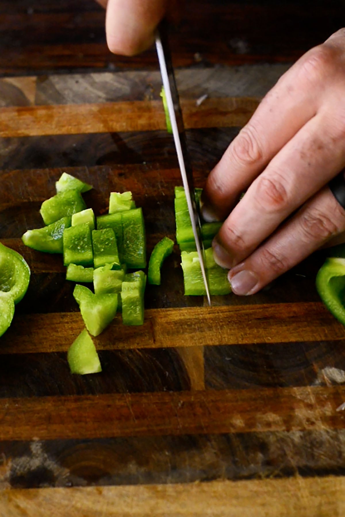 Green Bell Pepper being diced for the holy trinity in red beans and rice.