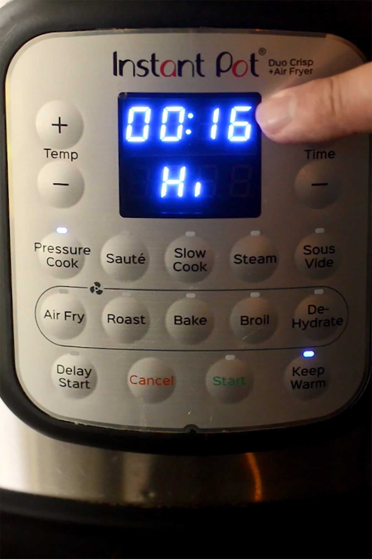 An instant pot set to pressure cook on high for 16 minutes for black-eyed peas.